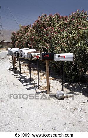 A row of mailboxes on a desert dirt road, Coachella Valley, California, USA View Large Photo Image Stock Photo - A row of mailboxes on a desert dirt road, Coachella Valley, California, USA. Fotosearch