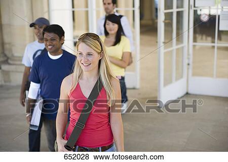 University students leaving a classroom building on campus View Large Photo Image Stock Photo - University students leaving a classroom building on campus. Fotosearch