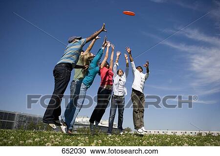University students playing Frisbee on campus View Large Photo Image Stock Image - University students playing Frisbee on campus. Fotosearch