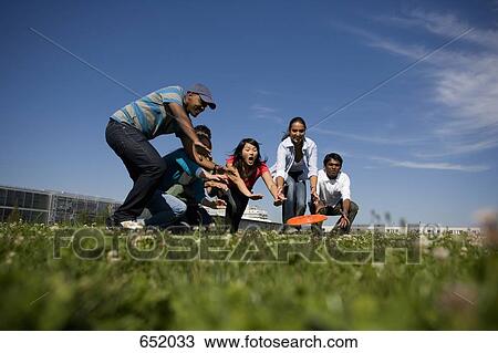 University students playing Frisbee on campus View Large Photo Image Stock Image - University students playing Frisbee on campus. Fotosearch