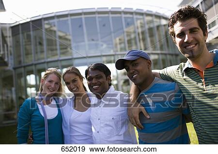 University students socializing on campus View Large Photo Image Stock Photo - University students socializing on campus. Fotosearch