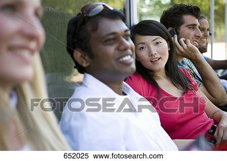 University students socializing on campus View Large Photo Image Stock Photography - University students socializing on campus. Fotosearch