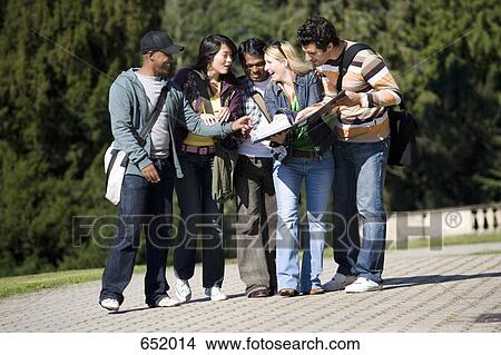 Picture - University students talking on campus. Fotosearch