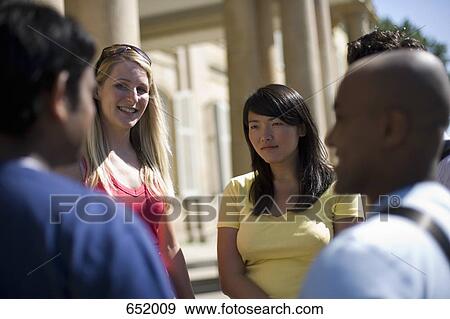 Stock Photo - University students talking on campus. Fotosearch