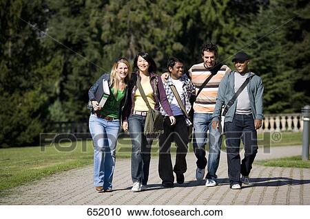 University students walking together on campus View Large Photo Image Stock Image - University students walking together on campus. Fotosearch