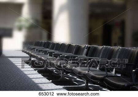 Empty seats in an airport lounge View Large Photo Image Stock Image - Empty seats in an airport lounge. Fotosearch