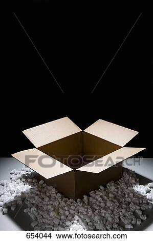 A cardboard box with packing peanuts View Large Photo Image Picture - A cardboard box with packing peanuts. Fotosearch