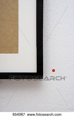 A picture frame with a red sticker next to it View Large Photo Image Stock Photo - A picture frame with a red sticker next to it. Fotosearch