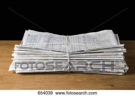 A stack of newspapers tied up with string View Large Photo Image Stock Photo - A stack of newspapers tied up with string. Fotosearch