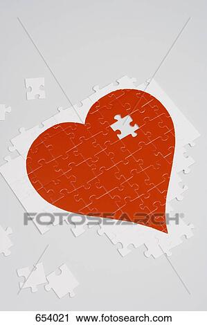 Jigsaw puzzle of a red heart View Large Photo Image Stock Image - Jigsaw puzzle of a red heart. Fotosearch