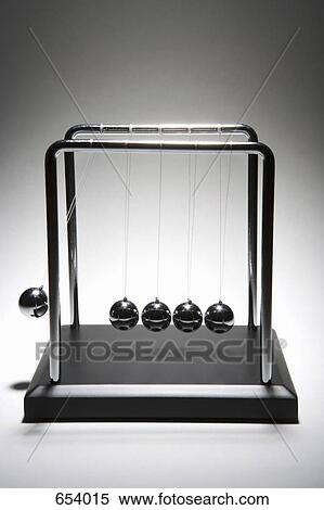 Newton’s Cradle desk toy View Large Photo Image Stock Photography - Newton’s Cradle desk toy. Fotosearch