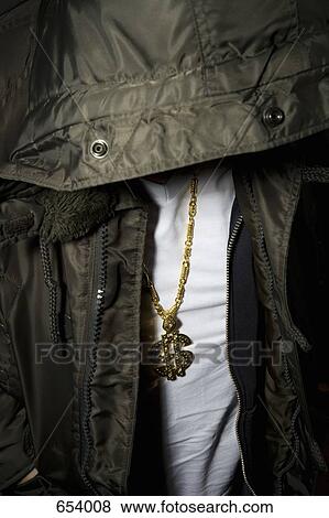 Young man wearing a dollar sign pendant View Large Photo Image Stock Photo - Young man wearing a dollar sign pendant. Fotosearch
