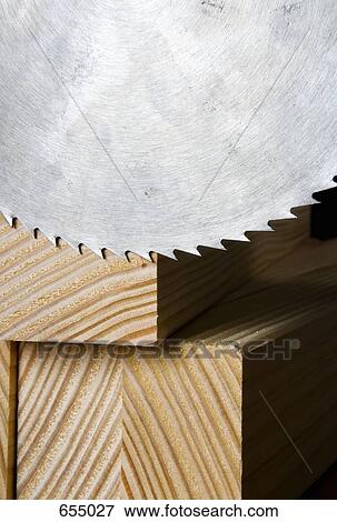 Circular saw blade and wood planks View Large Photo Image Stock Photo - Circular saw blade and wood planks. Fotosearch