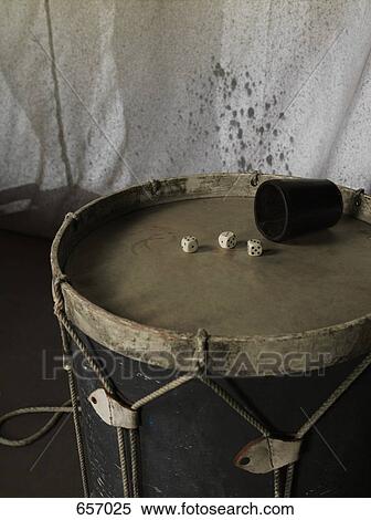 Dice and cup on a drum View Large Photo Image Stock Photography - Dice and cup on a drum. Fotosearch
