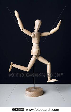 Stock Photo - Artist’s figure running with arms raised. Fotosearch