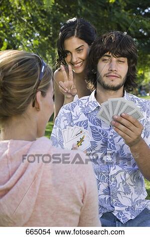 Friends playing cards View Large Photo Image Picture - Friends playing cards. Fotosearch