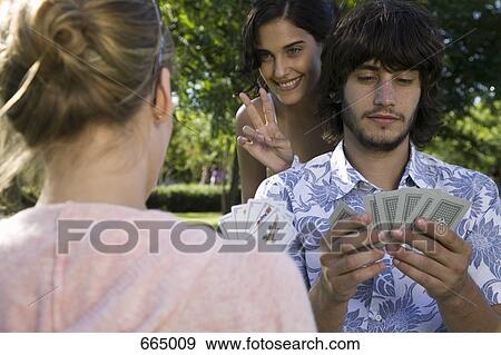 Friends playing cards View Large Photo Image Stock Photo - Friends playing cards. Fotosearch