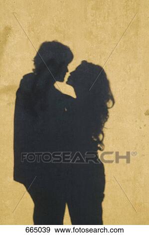 Stock Photo - Silhouette of a couple embracing. Fotosearch