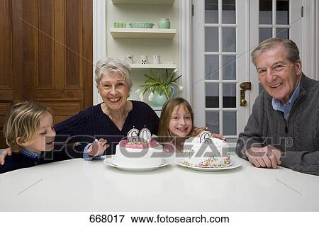 Grandparents and grandchildren celebrating a birthday View Large Photo Image Stock Photo - Grandparents and grandchildren celebrating a birthday. Fotosearch