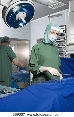 Surgeons in the operating room View Large Photo Image Stock Photo - Surgeons in the operating room. Fotosearch