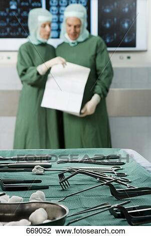 Surgeons in the operating theatre View Large Photo Image Stock Image - Surgeons in the operating theatre. Fotosearch