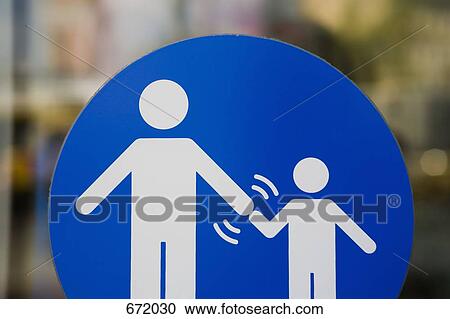 A crossing sign that indicates adults must hold a child’s hand View Large Photo Image Stock Image - A crossing sign that indicates adults must hold a child’s hand. Fotosearch