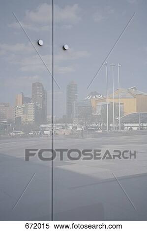 Close-up of glass panel with reflection of Potsdamer Platz, Berlin, Germany View Large Photo Image Stock Photography - Close-up of glass panel with reflection of Potsdamer Platz, Berlin, Germany. Fotosearch