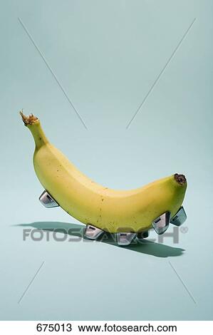 Stock Image - A banana with cleats attached to it. Fotosearch