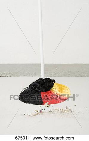 A broom made with the colors of the German flag next to a pile of dirt View Large Photo Image Stock Image - A broom made with the colors of the German flag next to a pile of dirt. Fotosearch