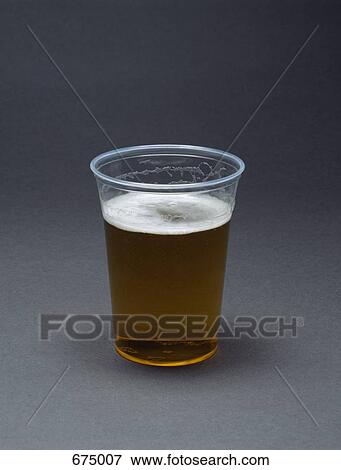 A plastic cup filled with beer View Large Photo Image Stock Photo - A plastic cup filled with beer. Fotosearch