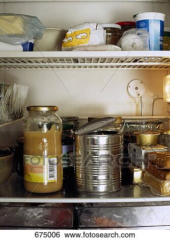 Refrigerator shelves full of food View Large Photo Image Stock Photograph - Refrigerator shelves full of food. Fotosearch