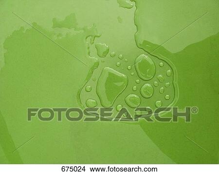 Picture - Water pooled on a green surface. Fotosearch
