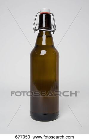 A brown beer bottle View Large Photo Image Stock Image - A brown beer bottle. Fotosearch