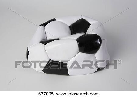 Stock Photography - A deflated soccer ball. Fotosearch