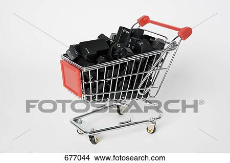 A miniature shopping cart full of computer keys View Large Photo Image Picture - A miniature shopping cart full of computer keys. Fotosearch
