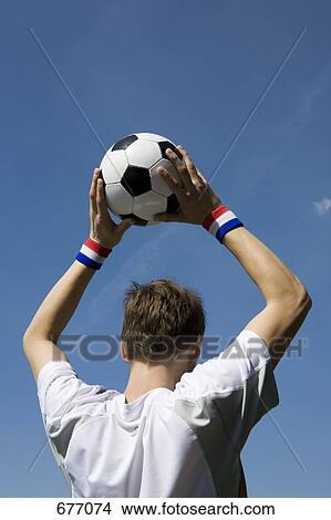 Picture - A soccer player throwing a soccer ball. Fotosearch
