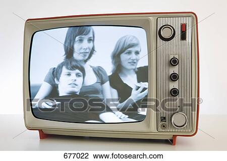 A television with a black and white image of three young people View Large Photo Image Stock Image - A television with a black and white image of three young people. Fotosearch