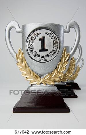 First, second and third place trophies in diminishing perspective View Large Photo Image Stock Image - First, second and third place trophies in diminishing perspective. Fotosearch