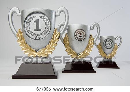 First, second and third place trophies in diminishing perspective View Large Photo Image Stock Photography - First, second and third place trophies in diminishing perspective. Fotosearch