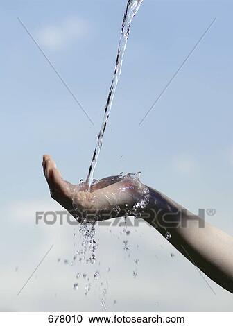 Stock Photography of Water pouring into a cupped human hand 678010 ...