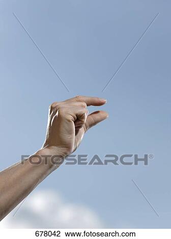 Human fingers making a measuring gesture View Large Photo Image Stock Image - Human fingers making a measuring gesture. Fotosearch