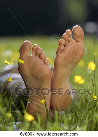 Stock Photo - The soles of a person's bare feet, close up. Fotosearch