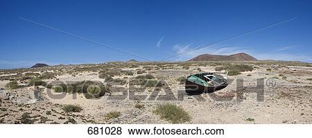 Stock Photo - A boat marooned on land. Fotosearch