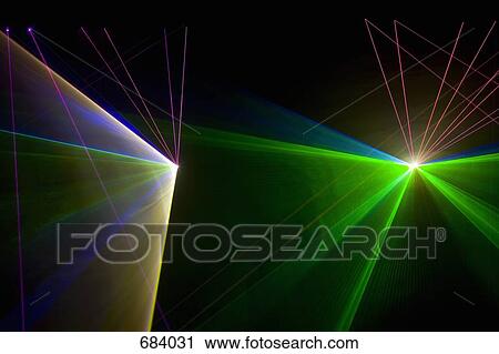 Stock Image - Multi colored laser lights. Fotosearch