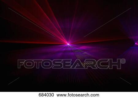 Stock Image - Pink and purple laser lights. Fotosearch