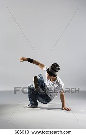 A B-boy doing a breakdance move View Large Photo Image Stock Image - A B-boy doing a breakdance move. Fotosearch