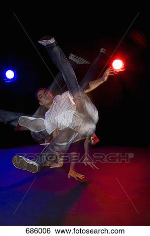 A B-boy doing a Flare breakdance move, stroboscopic effect View Large Photo Image Stock Photograph - A B-boy doing a Flare breakdance move, stroboscopic effect. Fotosearch