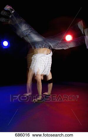 A B-boy doing a Flare breakdance move View Large Photo Image Stock Photograph - A B-boy doing a Flare breakdance move. Fotosearch