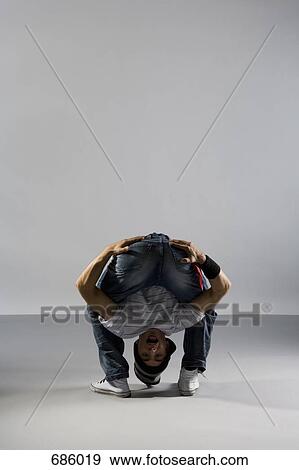 A B-boy doing a Freeze breakdance move View Large Photo Image Stock Photo - A B-boy doing a Freeze breakdance move. Fotosearch