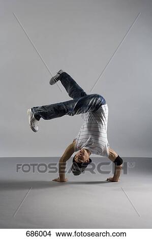 A B-boy doing a Handstand Freeze breakdance move View Large Photo Image Picture - A B-boy doing a Handstand Freeze breakdance move. Fotosearch
